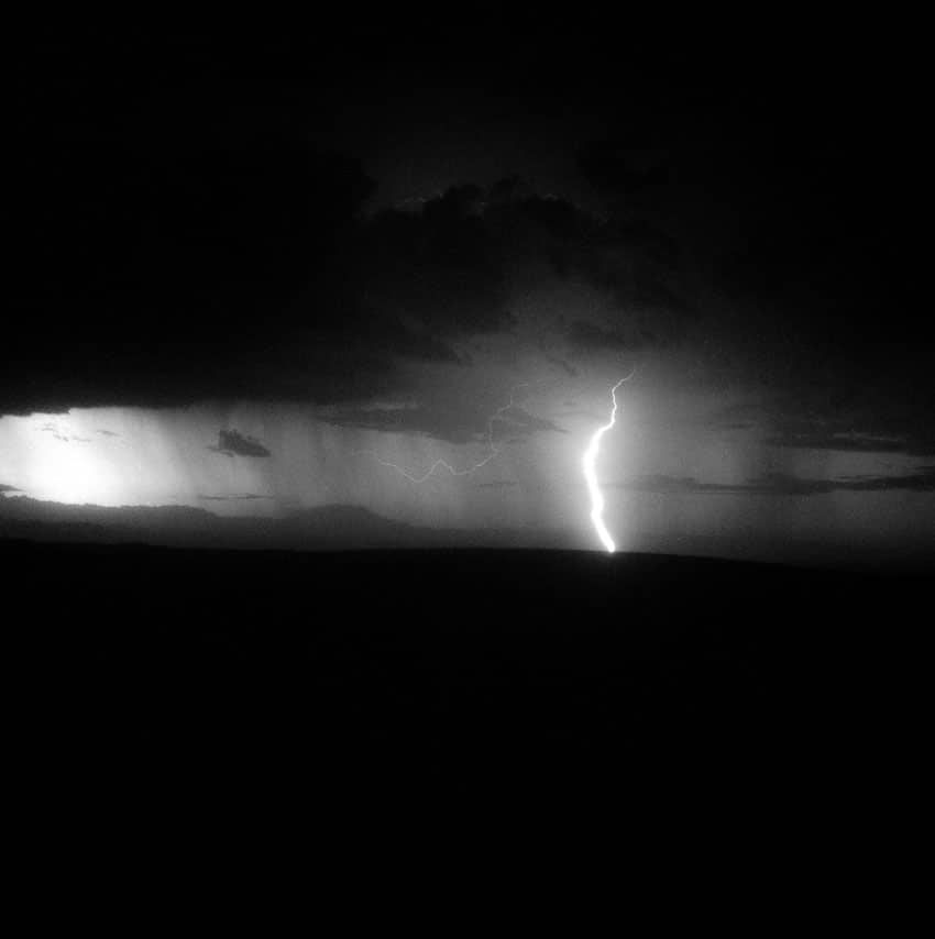 Black and white medium format film image of a lightning strike at the sand dunes in New Mexico - White Sands by Madison Lloyd on Shoot It With Film
