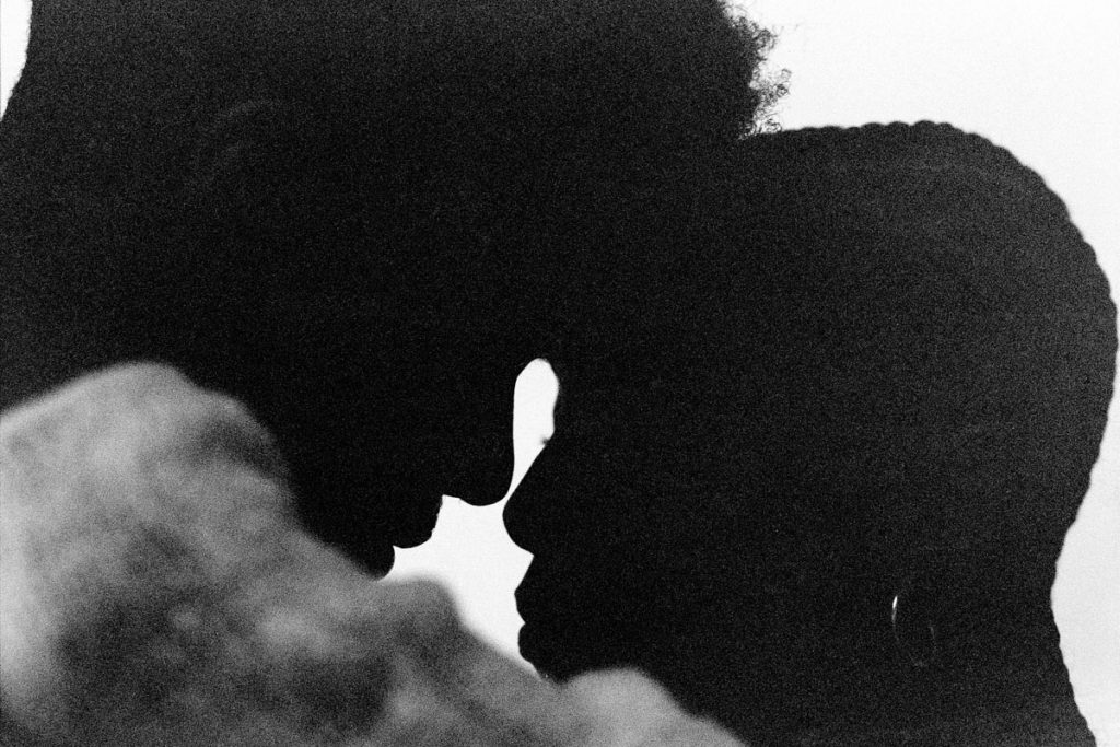 Medium format film image of two people with foreheads touching - 5 Film Photography Terms by John Adams on Shoot It With Film