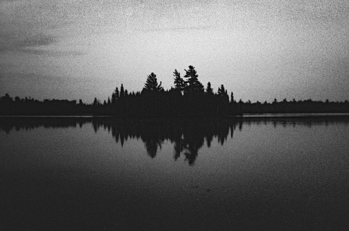 35mm black and white film image of a lake - How to Bulk Roll Film on Shoot It With Film